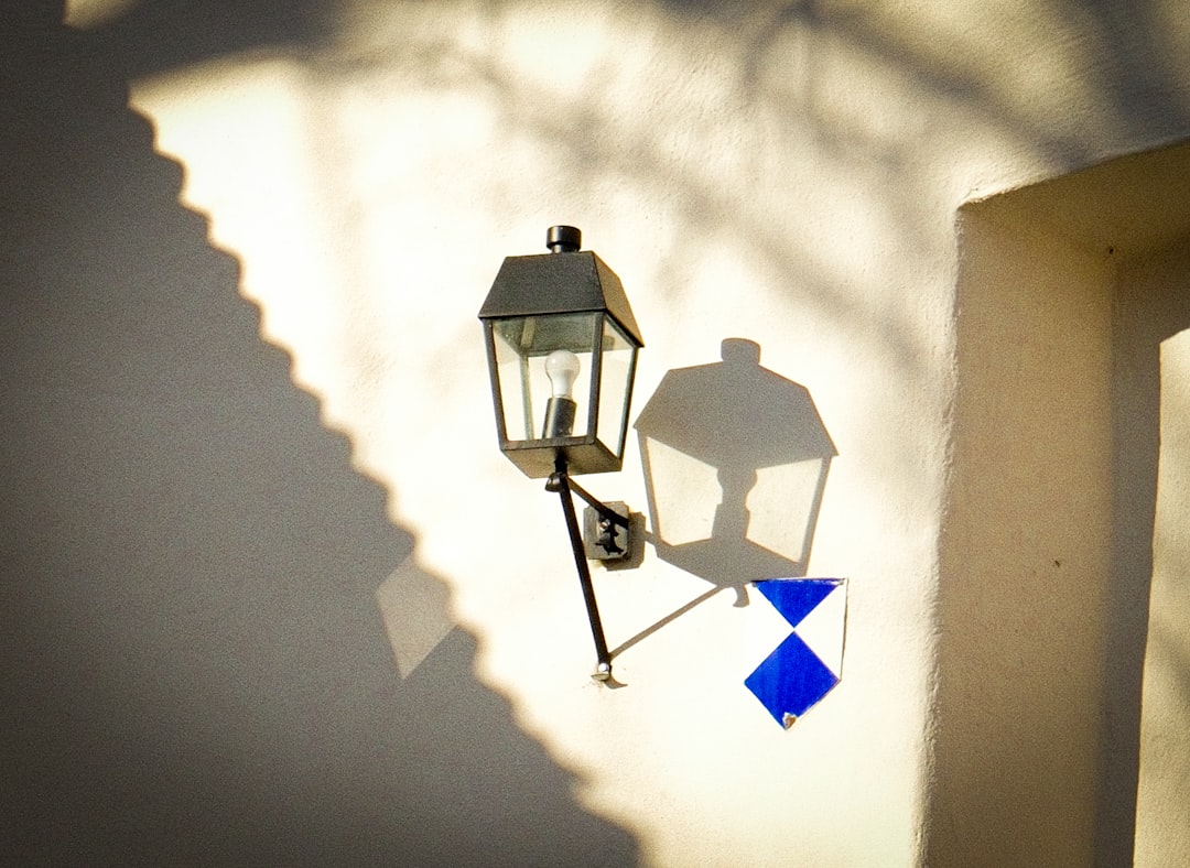 Enhance Your Bedroom with an Adjustable Swing-Arm Bedside Wall Sconce